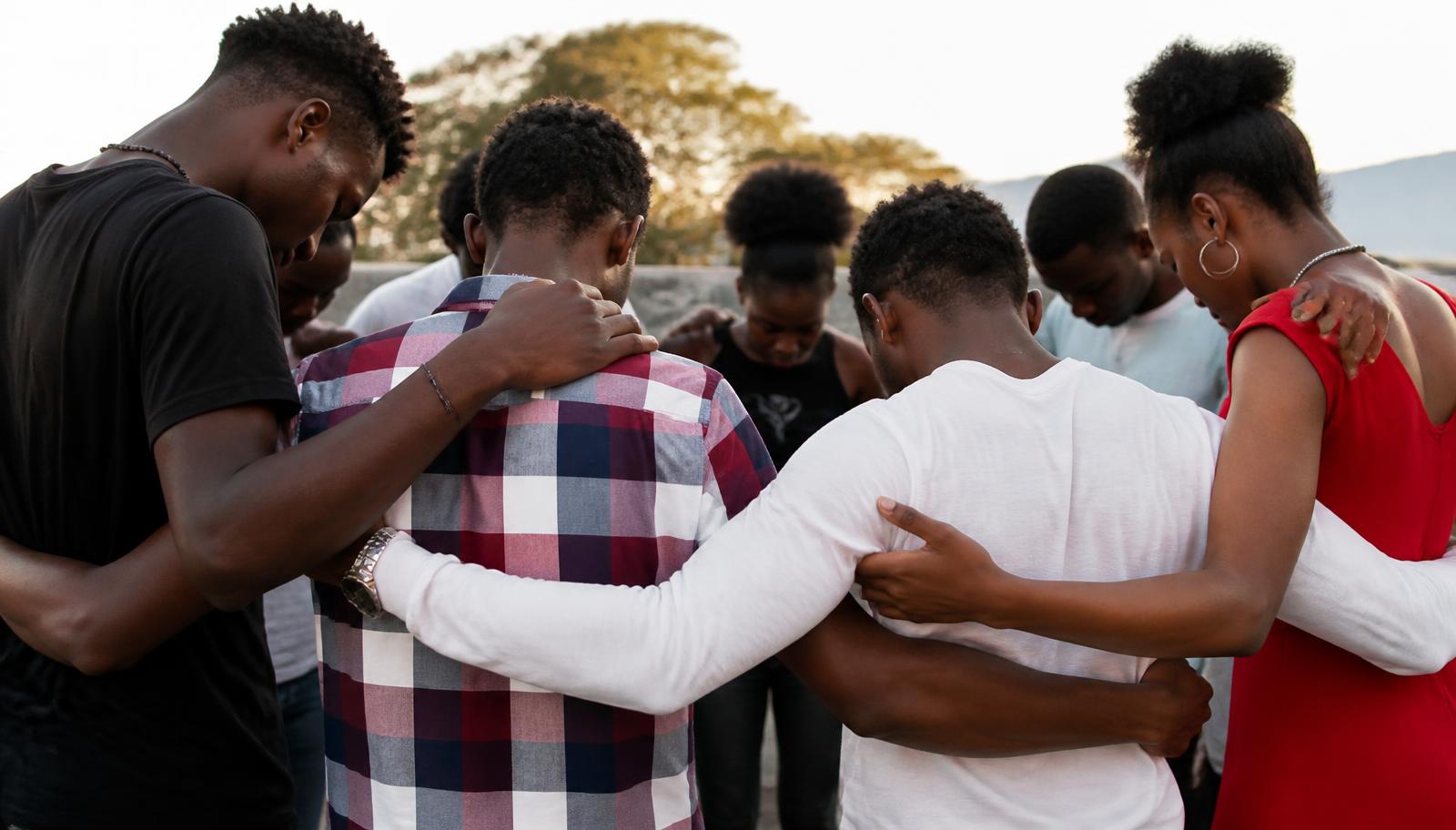 Placeholder — believers praying together in Cap-Haitien